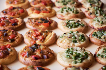 Freshly baked mini pizzas Cocas