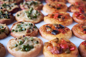 Freshly baked mini pizzas cocas
