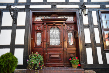 Old wooden door in half-timbered buildings.