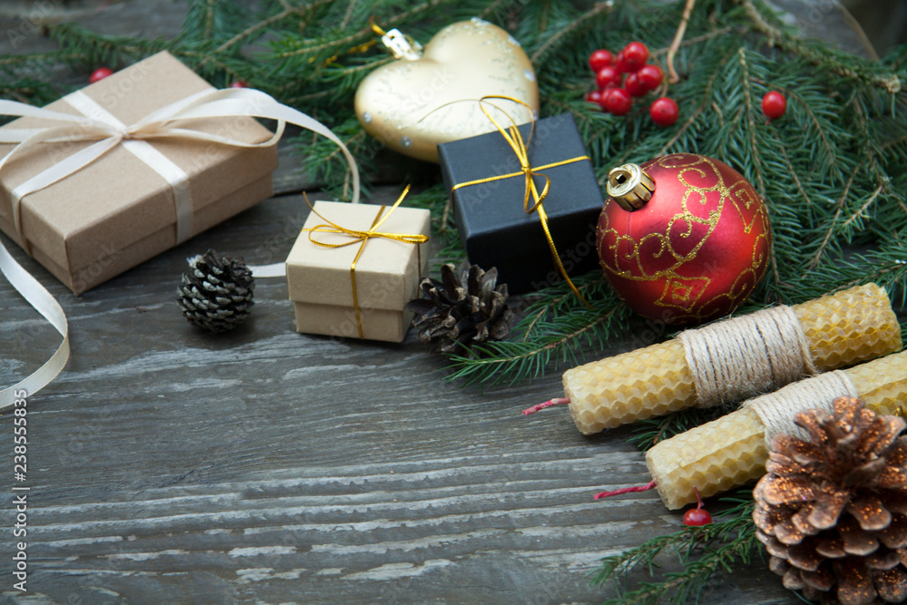 Wall mural Christmas gift boxes on a rustic wooden background