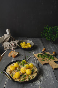 Homemade chicken meatballs with champignon cream sauce, soy sauce, with parmesan, parsley and baguette