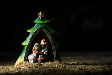 the holy family in a rustic nativity scene