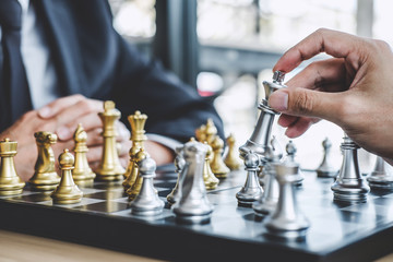 Two businessman playing chess game to plan strategy for success, thinking for planning overcoming difficulty and achieving goals business strategy for win