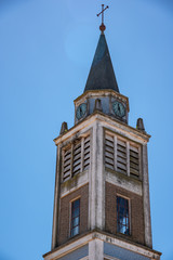 Obraz premium Dome or Bell tower of an old church with a clock in a day with a blue clean sky