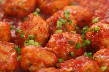 Meatballs in tomato sauce. Side view. Selective focus.