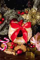 Cream Puff Rings (choux pastry) and Cookies on Wooden Background Festive Christmas Food Concept Candy Cane Christmas Wreath
