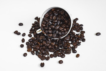 cup of coffee with beans on white background