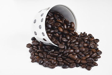 cup of coffee with beans on white background