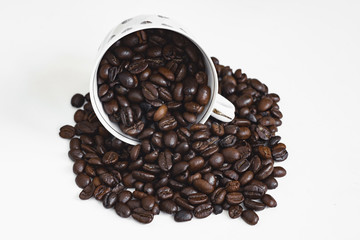 cup of coffee with beans on white background
