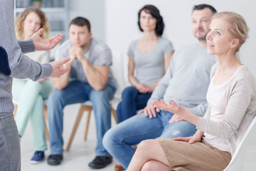 Man talking with woman about problems during therapy for couples