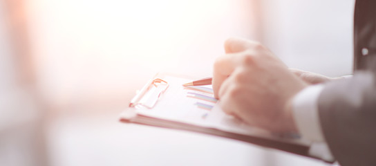 close up. businessman doing market analysis.business concept