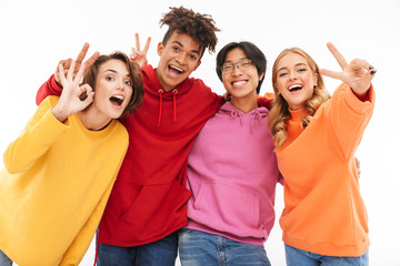 Group of cheerful teenagers isolated