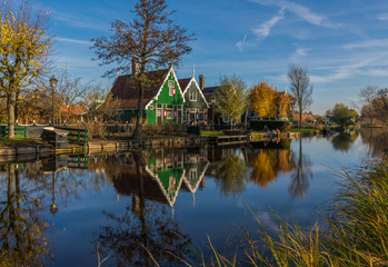 Fototapeta na wymiar Zaanse Schans, Netherlands - considered a real open air museum, Zaanse Schans presents a collection of well-preserved historic windmills and houses