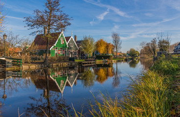 Fototapeta na wymiar Zaanse Schans, Netherlands - considered a real open air museum, Zaanse Schans presents a collection of well-preserved historic windmills and houses
