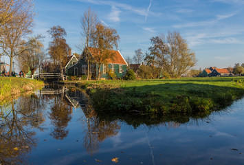Fototapeta premium Zaanse Schans, Netherlands - considered a real open air museum, Zaanse Schans presents a collection of well-preserved historic windmills and houses
