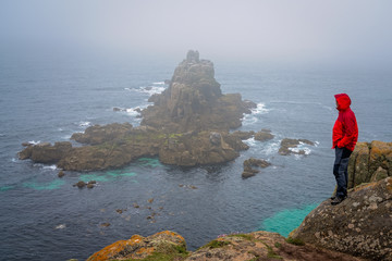 Tourist admiring landscape of Lands End