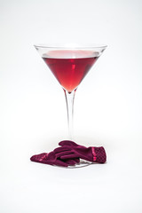 Huge glass with red wine on white background