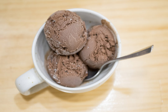 Chocolate ice cream on wooden background