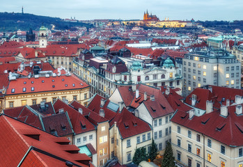 Naklejka na ściany i meble Aerial view over Prague from Old town hall tower at dusk. Beautiful travel background.