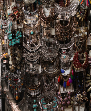Colorful necklaces and accessories hanging on display in Mumbai street market