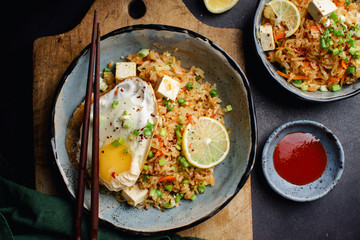 Vegetarian fried rice with tofu, peas and vegetables. Asian cuisine, healthy lunch