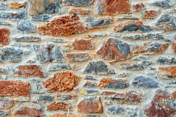 Stone wall fence rustic texture background close-up.