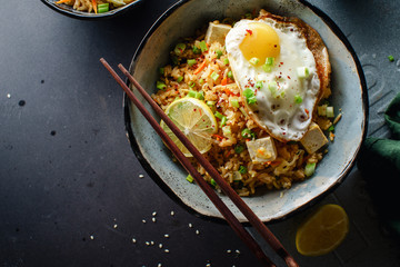 Vegetarian fried rice with tofu, peas and vegetables. Asian cuisine, healthy lunch