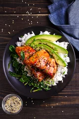  Salmon in honey-soy glaze with rice, spinach and avocado. overhead, vertical © freeskyline