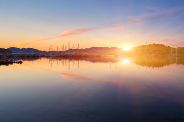 port of Kekova with moored yachts during sunset, Turkey