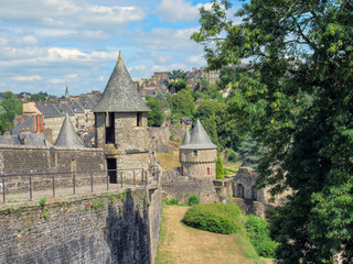 Fototapeta na wymiar Wall and towers in the Medieval town and Castle of Fougeres, Brittany, northwestern France