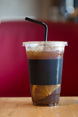 Black coffee mixed with orange slice