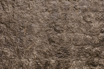 Texture of a stone wall. Old castle stone wall texture background. Stone wall as a background or texture. Part of a stone wall, for background.