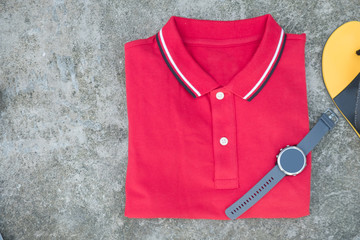 Red polo shirt and smart watch