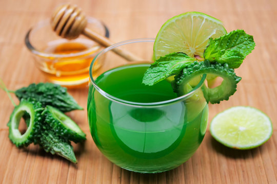 Juice Of Bitter Gourd With Raw And Sliced Bitter Gourd.Healthy Herbal Drink