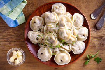 Dumplings, filled with meat, ravioli, pelmeni. Dumplings with filling. overhead, horizontal