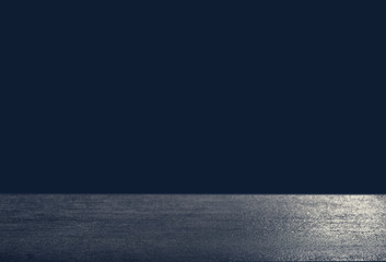 Dark background in front of empty stone concrete table for a celebration card, space for text...
