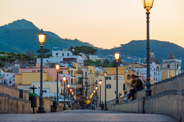 Sunset view Ischia street with colourful houses, Italy