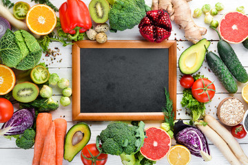 Fresh vegetables and fruits on a white wooden background. Healthy Organic Food. Top view. Free copy space.