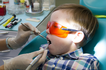 Reception at the dentistry. The dentist examines the oral cavity. Close up