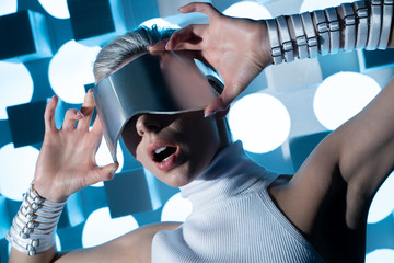 girl in a virtual reality helmet screaming