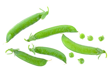 Fresh green pea pods and peas on a white background, top view.