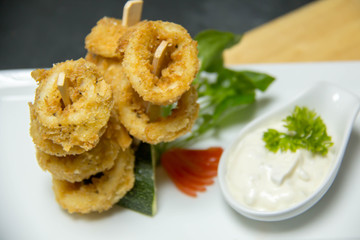 Tasty calamari rings deep fried in soft dough