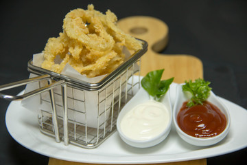 Tasty calamari rings deep fried in soft dough