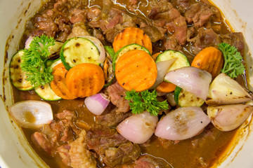 Fototapeta na wymiar Bowl of beef stew and carrot