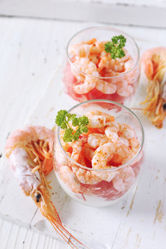 Two verrines for appetizer. Shrimp with grapefruit and cream
