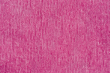 Texture of a soft pink fabric shot close-up