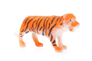 tiger made out of plastic. animal toy isolated on white background