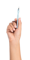 hand holding Stainless steel nail cuticle pusher covered in blue plastic isolated on white...