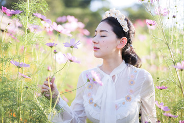 Beautiful girl With a field of flowers