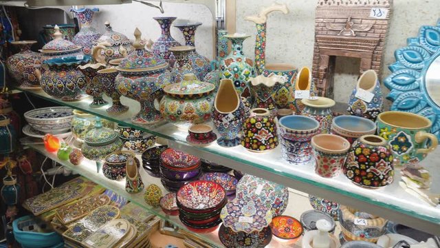 Colorful traditional souvenir tableware at Tajrish Bazaar, Iran